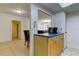 Kitchen area features wooden cabinets with blue countertop, stainless steel trash can and updated, stainless-steel appliances at 5396 Gulf Blvd # 110, St Pete Beach, FL 33706