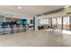 Spacious living area featuring tile flooring, a bar area, and ocean views at 5396 Gulf Blvd # 110, St Pete Beach, FL 33706