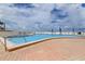 Resort-style pool area with ocean views and plenty of lounge chairs at 5396 Gulf Blvd # 110, St Pete Beach, FL 33706