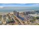 Complex aerial view, highlighting parking, beach access and ocean views at 5396 Gulf Blvd # 904, St Pete Beach, FL 33706