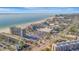 A coastal aerial view, highlighting beachfront condos and the scenic ocean at 5396 Gulf Blvd # 904, St Pete Beach, FL 33706