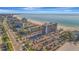 Aerial view, showing the beach and the city skyline at 5396 Gulf Blvd # 904, St Pete Beach, FL 33706