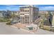 An aerial view of a beachfront condominium showcasing its private pool and beach access at 5396 Gulf Blvd # 904, St Pete Beach, FL 33706