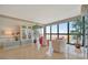 Bright living room with large windows showcasing a beachfront view, modern furniture and wood floors at 5396 Gulf Blvd # 904, St Pete Beach, FL 33706