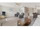 Cozy living room featuring wood-look floors, comfortable recliners, and decorative accents at 5973 Terrace Park N Dr # 103, St Petersburg, FL 33709