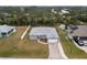 An aerial view of the property, highlighting the home's exterior and landscaping at 6131 Tedder St, Port Charlotte, FL 33981