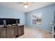 Bedroom with a ceiling fan, window and neutral tile flooring at 6131 Tedder St, Port Charlotte, FL 33981