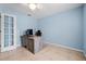 Bedroom with a ceiling fan, window and neutral tile flooring at 6131 Tedder St, Port Charlotte, FL 33981