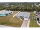 Aerial view of a well-maintained single-Gathering home with a fenced backyard at 6131 Tedder St, Port Charlotte, FL 33981