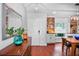 Inviting foyer with hardwood floors, decorative mirror, and built-in shelving at 6531 Clair Shore Dr, Apollo Beach, FL 33572