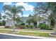 Charming home featuring mature landscaping, a well-manicured lawn, and a welcoming facade at 6531 Clair Shore Dr, Apollo Beach, FL 33572