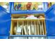 Kitchen cabinet featuring adjustable shelf inserts and cookware at 6531 Clair Shore Dr, Apollo Beach, FL 33572