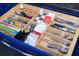 Organized kitchen drawer featuring cutlery, spoons, coffee, and tea at 6531 Clair Shore Dr, Apollo Beach, FL 33572