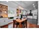 Modern kitchen featuring white and blue cabinets and an open floor plan at 6531 Clair Shore Dr, Apollo Beach, FL 33572