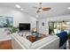 Cozy living room featuring hardwood floors, contemporary decor, and a large window at 6531 Clair Shore Dr, Apollo Beach, FL 33572