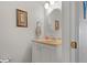 Powder room with a vanity, sink, and framed mirror at 6800 20Th N Ave # 405, St Petersburg, FL 33710