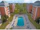 Aerial view of the rectangular community pool, surrounded by lounge chairs and tables at 6800 20Th N Ave # 405, St Petersburg, FL 33710