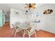 Dining area with an outdoor view, a small sink, and white upper cabinets at 854 Bay Point Dr, Madeira Beach, FL 33708