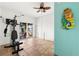 Exercise room features tile floors, seahorse decor, and views of the water at 854 Bay Point Dr, Madeira Beach, FL 33708