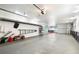 Wide and spacious garage with overhead lighting and room for storage along the walls at 854 Bay Point Dr, Madeira Beach, FL 33708