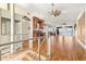 Elegant living area with hardwood floors, custom bar, and views of the lake at 854 Bay Point Dr, Madeira Beach, FL 33708