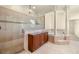 Bathroom showcasing walk-in shower, soaking tub, and lots of natural light at 854 Bay Point Dr, Madeira Beach, FL 33708