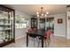 Bright dining area with stylish furniture, cabinets and glass patio doors at 932 Lexington Dr, Dunedin, FL 34698