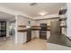 Bright kitchen with stainless steel appliances and ample cabinet space at 932 Lexington Dr, Dunedin, FL 34698