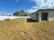 Expansive backyard featuring healthy grass and a well-maintained privacy fence at 9377 Benrock Rd, Spring Hill, FL 34608