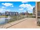 Relaxing balcony space overlooking a serene pond and fountain with residential buildings at 960 Starkey Rd # 3106, Largo, FL 33771