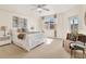 A sunny bedroom with a ceiling fan and a large window at 960 Starkey Rd # 3106, Largo, FL 33771