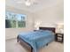 Bedroom with large window and full sized bed at 960 Starkey Rd # 3106, Largo, FL 33771