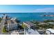 Stunning aerial view of a coastal community with waterfront condos, a bay, and a bridge in the distance at 100 Bluff View Dr # 514A, Belleair Bluffs, FL 33770