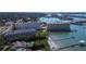 Overhead view of waterfront condos, dock, pool and landscaping at 100 Bluff View Dr # 514A, Belleair Bluffs, FL 33770