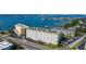 Panoramic aerial view of waterfront condos, showcasing stunning water views and convenient parking at 100 Bluff View Dr # 514A, Belleair Bluffs, FL 33770