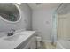 This bathroom features a new vanity, toilet and a shower-tub combo at 100 Bluff View Dr # 514A, Belleair Bluffs, FL 33770