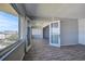 Bedroom with double doors, a large closet, wood floors, and lots of natural light at 100 Bluff View Dr # 514A, Belleair Bluffs, FL 33770
