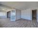 Bedroom with closet, wood floors, double doors to living room, and natural light at 100 Bluff View Dr # 514A, Belleair Bluffs, FL 33770