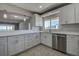 A beautifully updated kitchen with white cabinets, stainless steel appliances, and countertops at 100 Bluff View Dr # 514A, Belleair Bluffs, FL 33770