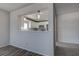 Bright kitchen view overlooking the living area with white cabinets and modern stainless steel appliances at 100 Bluff View Dr # 514A, Belleair Bluffs, FL 33770