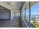 Open living room with views of the waterway, a community pool, and beautiful grounds at 100 Bluff View Dr # 514A, Belleair Bluffs, FL 33770