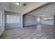 Spacious living room with a view of the open concept dining area and modern white kitchen at 100 Bluff View Dr # 514A, Belleair Bluffs, FL 33770