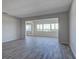 Bright living room with wood floors, a large window with a scenic water view at 100 Bluff View Dr # 514A, Belleair Bluffs, FL 33770