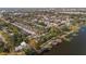 Aerial view of the townhome community on the water showing the pool, and landscaping at 10221 Sailwinds S Blvd # 206, Largo, FL 33773