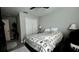 Comfortable bedroom with a ceiling fan, closet, and a bed with a floral patterned comforter at 10854 Sage Canyon Dr, Riverview, FL 33578