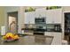 Well-equipped kitchen with granite countertops and stainless steel appliances at 10854 Sage Canyon Dr, Riverview, FL 33578