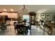 Open-concept living area with adjacent kitchen and dining space, perfect for entertaining at 10854 Sage Canyon Dr, Riverview, FL 33578