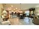 Spacious living area with kitchen and dining, featuring tile flooring and recessed lighting at 10854 Sage Canyon Dr, Riverview, FL 33578