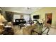 Comfortable living room with seating, large windows, and view of the backyard at 10854 Sage Canyon Dr, Riverview, FL 33578