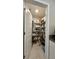 Walk-in pantry with shelving and ample storage space for groceries and household items at 10854 Sage Canyon Dr, Riverview, FL 33578